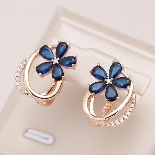 Gold Flower Earrings with Sapphire Elegance